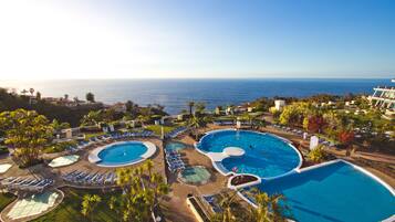 Outdoor pool, open 10:00 AM to 6:00 PM, pool umbrellas, sun loungers