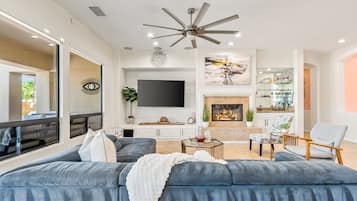 House | Living room | 65-inch Smart TV with satellite channels, TV, fireplace