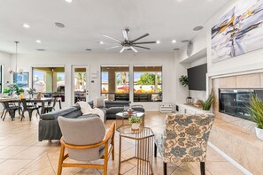 House | Living room | 65-inch Smart TV with satellite channels, TV, fireplace - Luxurious Villa Living in Indio w/ Pool/Spa (Indio)