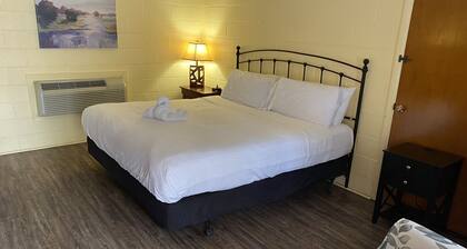 King Guest Room located at the Joplin Inn at the entrance to Mountain Harbor, just 2 1/2 miles from Lake Ouachita. by RedAwning