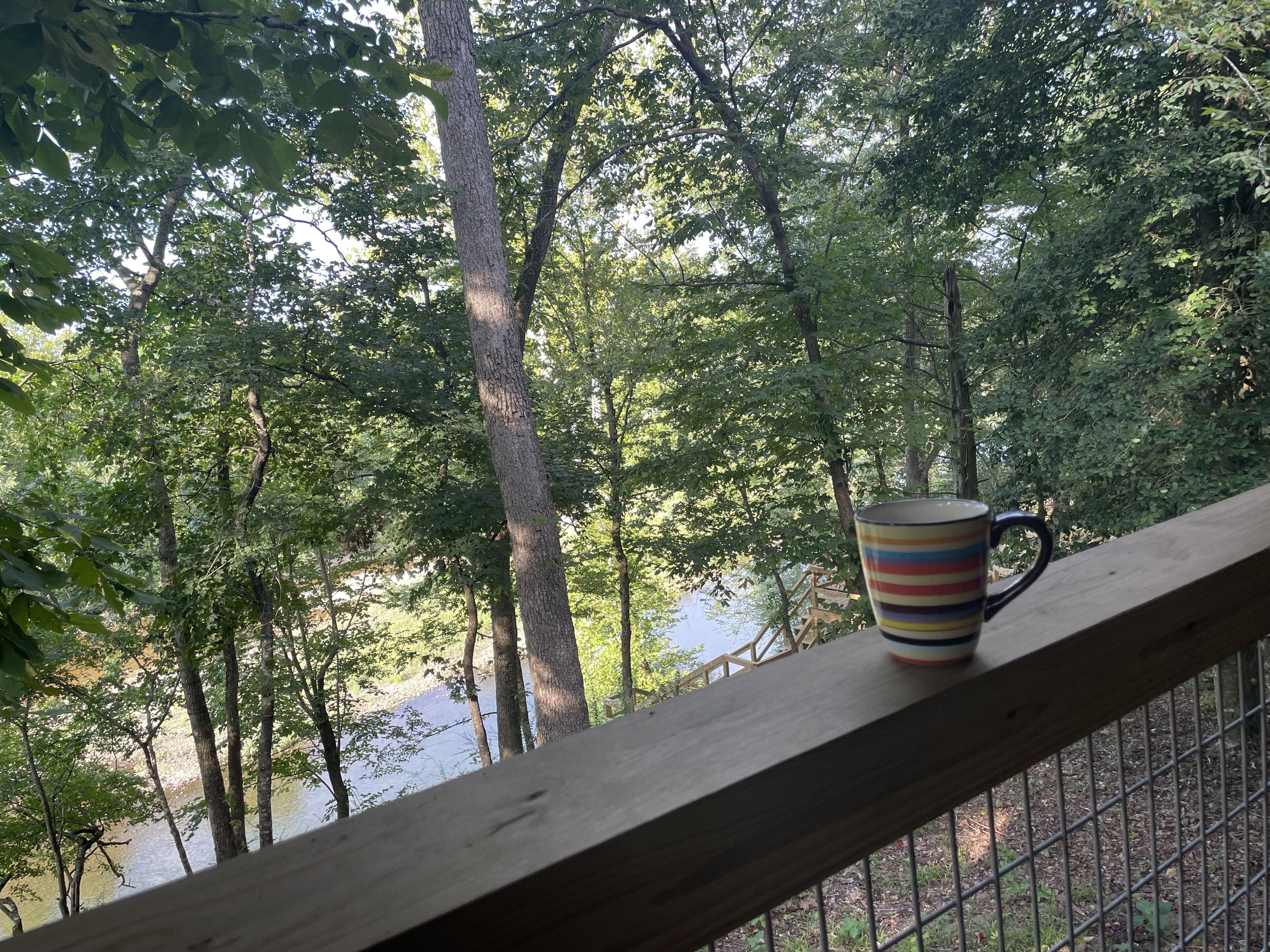Enjoying a cup of coffee, while watching the river before anyone else is up