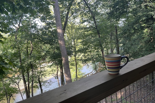Enjoying a cup of coffee, while watching the river before anyone else is up