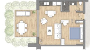 Een plattegrond van een hotelkamer met een bed, een bureau, een stoel, een klein tafeltje, een sofa, een badkamer met toilet en wastafel, en een douchehoek.