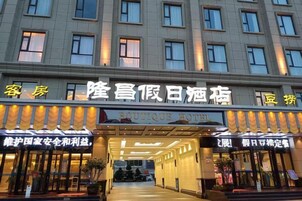 A hotel entrance with a sign indicating it is a boutique hotel.
