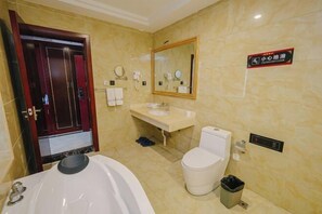 A bathroom with a bathtub, toilet, and sink. There is a mirror above the sink and a sign on the wall. - Boyin Hotel (Jiang County)