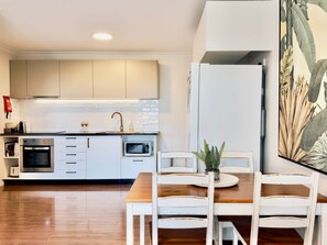Fridge, microwave, oven, stovetop - Sand - Relaxed Coastal Vibes, Bay Views, Dog Friendly (East Ballina)