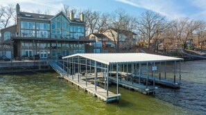 Enjoy waterfront views from the spacious balcony with multiple windows.