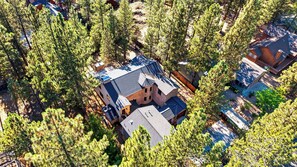 A residential area with multiple houses surrounded by dense trees. - Walk to Lake 6BR Cabin w/ Game Room, Hot Tub Big Bear Castle (Big Bear Lake)