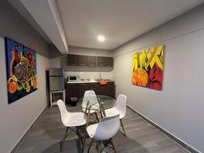 Basic Apartment | Private kitchen | Microwave, blender, cookware/dishes/utensils, dining tables