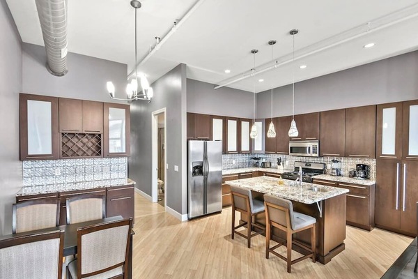 Living Room / Dining Room combo with fully stocked kitchen