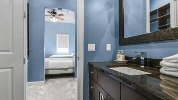 Shower, hair dryer, towels, shampoo