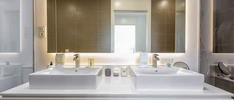 Bathtub, hair dryer, towels, soap