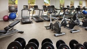 A gym with treadmills, weight machines, and dumbbells. - Marriott Shadow Ridge Village, 1 bedroom. Short Ride to Coachella Music Festival (Palm Desert)