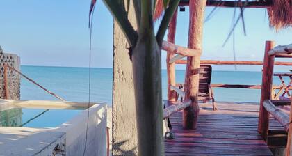 Pasilla suite. Ocean view glass doors to the turquoise water, 13foot Tv screen