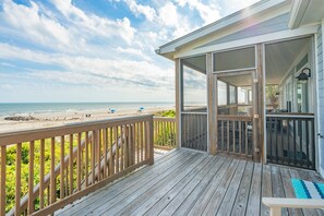 A wooden deck with a view of the beach and ocean. - Oceanfront, Large Screen Porch, Gas Grill, Luxury Family Rental (Folly Beach)