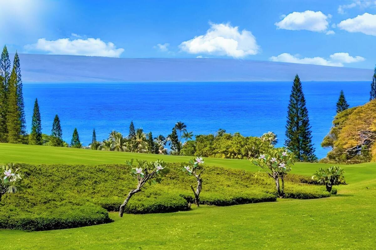 A golf course with a view of the ocean.