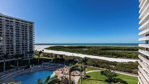 A hotel with a pool, beach view, and a mangrove area. - Step into Paradise at South Seas Towers 4-805 (Marco Island)