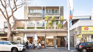 A multi-story building with a storefront labeled "Pasta Pantry" and a discount chemist on the ground floor. - Bellevue Hill Designer, Beaches, City & Views (Bellevue Hill)