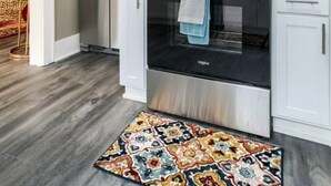 A modern kitchen with white cabinets, a stainless steel microwave, oven, and refrigerator. - Cozy vintage getaway minutes from downtown! (Lincoln)