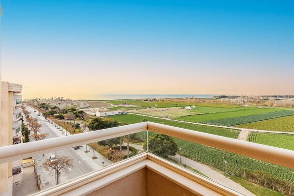 Enjoy breathtaking views of the coastal landscape from this balcony.