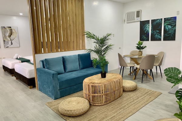 Chambre Simple Exécutive, plusieurs lits, non-fumeur, vue jardin | Coin séjour