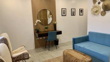 Junior Single Room | Living area | 55-inch Smart TV with digital channels, TV