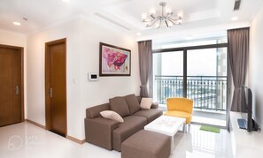 Standard Triple Room, 2 Bedrooms, Ensuite, Tower | Living area | 43-inch Smart TV with cable channels, TV - Kelly House at Vinhomes Central Park (Ho Chi Minh City)