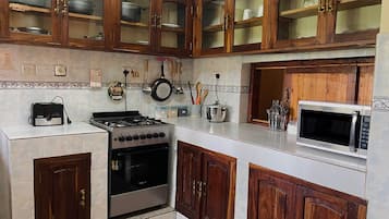 Fridge, microwave, toaster, cookware/dishes/utensils