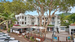 A multi-story hotel with balconies, a café bar, and a boutique. - Alassio 1 Bedroom Ground Floor Pool Access 104/1 (Palm Cove)