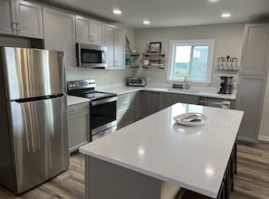 Fridge, microwave, oven, stovetop - Reel Cajun - Boat Access - Island Realty (Grand Isle)