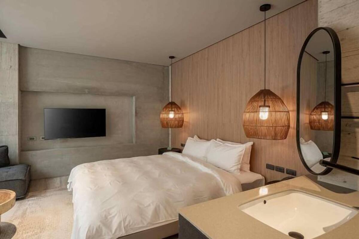 Premium bedding, down duvets, memory-foam beds, free minibar items