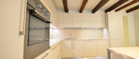 Apartment | Private kitchen | Full-size fridge, oven, dishwasher, espresso maker