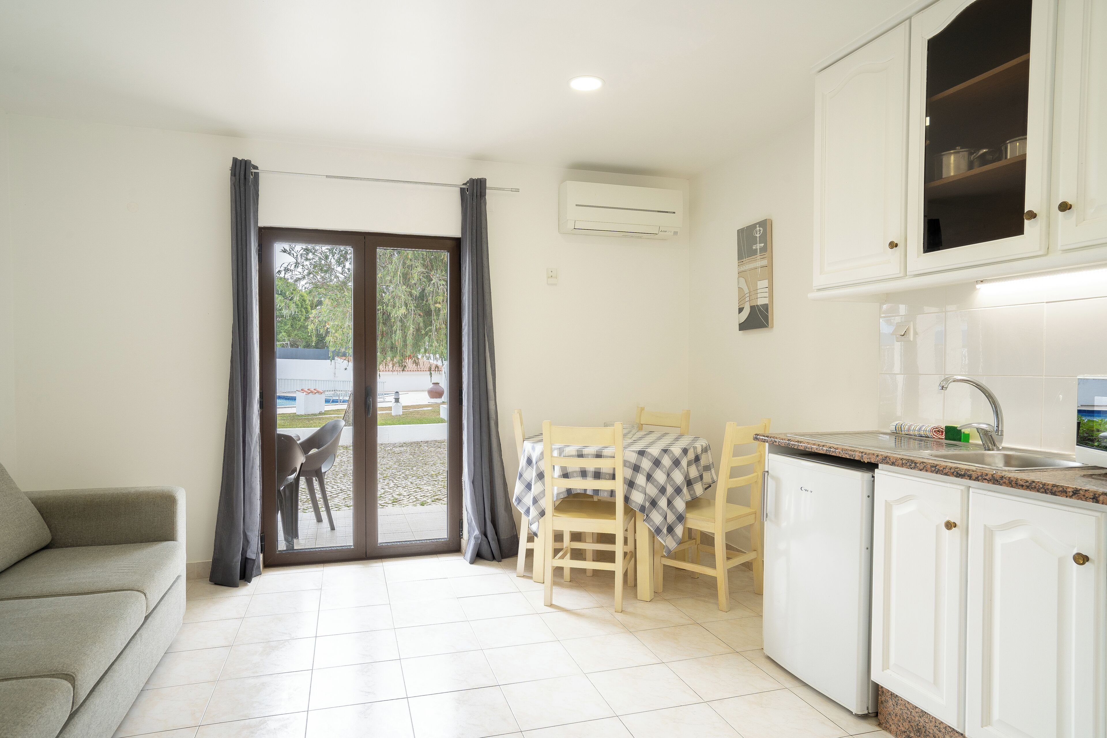 Standard Apartment, Garden View | Private kitchen | Mini-fridge, microwave, stovetop, cookware/dishes/utensils