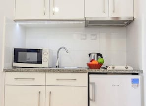 Mini-fridge, microwave, stovetop, cookware/dishes/utensils