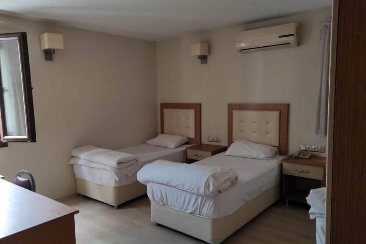 deluxe triple room | premium bedding, laptop workspace, bed sheets