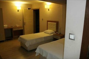 Deluxe Room, Multiple Beds | Premium bedding, laptop workspace, bed sheets