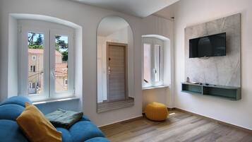 Deluxe Double Room, 1 Queen Bed | Living area | 81-cm LCD TV with digital channels, TV