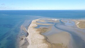 An aerial view of a coastal area with sandy beaches and clear blue waters. - 6 Person Holiday Home in Laeso (Læsø)