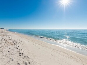 A beach with clear skies and calm waters. - Phoenix X by Brett Robinson Vacations (Orange Beach)