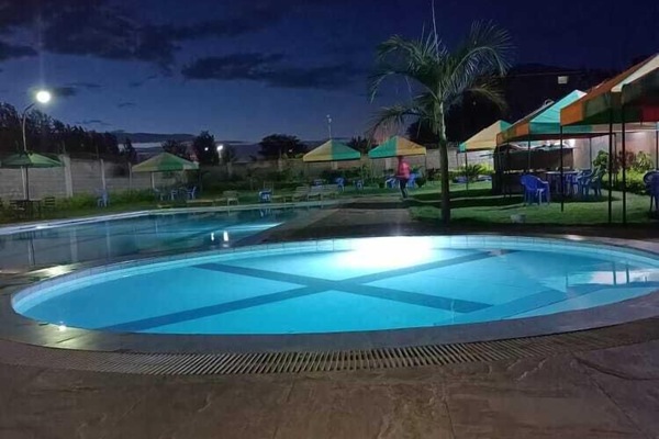 Outdoor pool, sun loungers, lifeguards on site