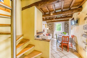 Family House, 2 Bedrooms, Mountainside (Beppe's House in Garfagnana) | Living room | 21-inch Smart TV with digital channels, fireplace