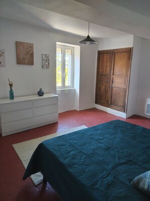A bedroom with a bed, a dresser, a window, and a wardrobe. - HOUSE IN LUBERON (Viens)