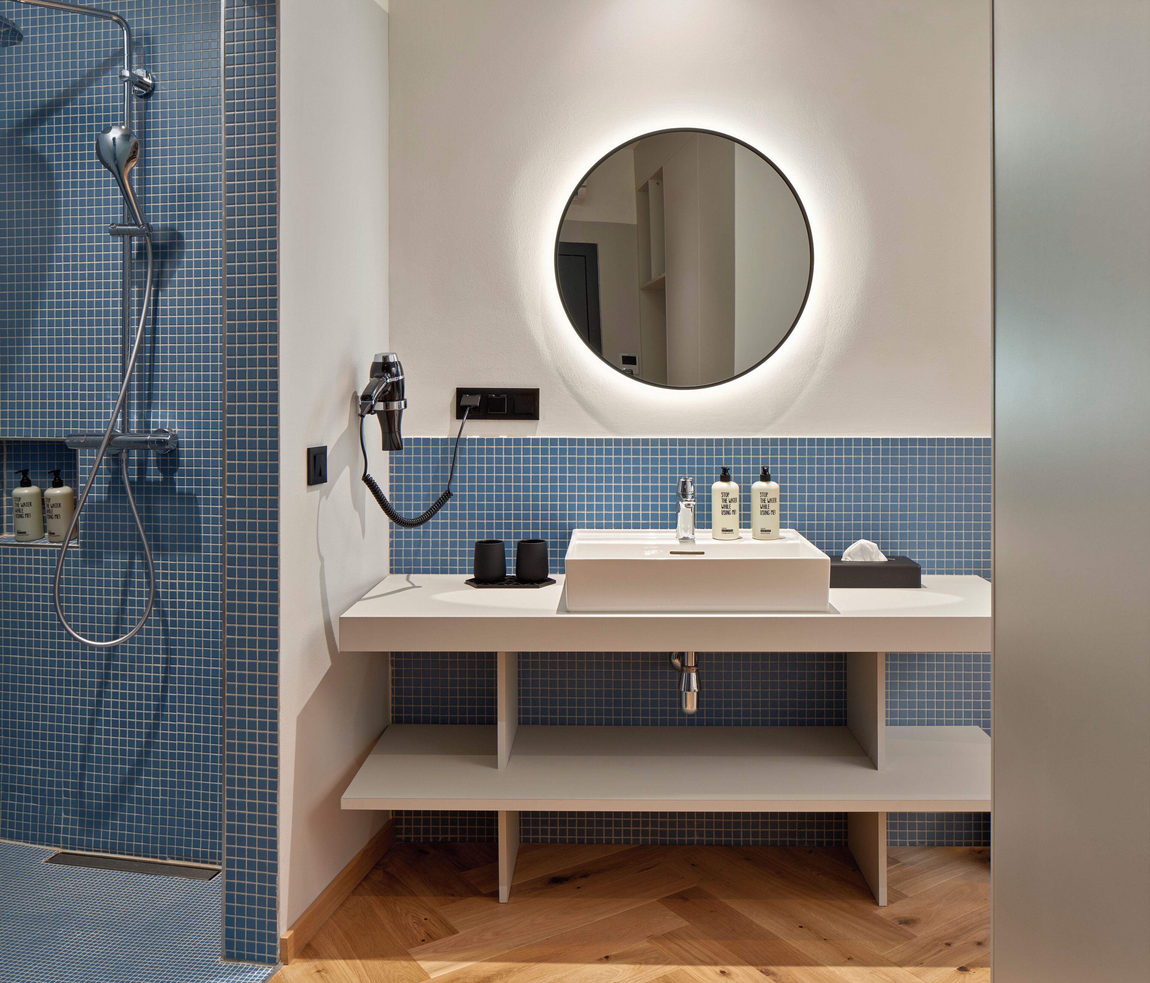 Basic Studio | Bathroom | Shower, rainfall showerhead, hair dryer, towels