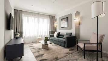 Executive Apartment | Living area | 48-inch flat-screen TV with digital channels, TV