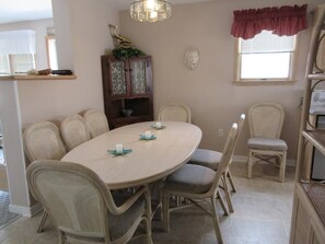 Enjoy meals in this cozy dining area with a round table and six comfortable chairs.