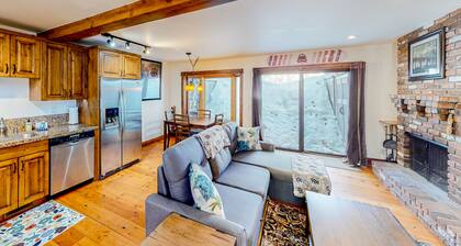 Inviting riverfront home with balcony, fireplace, skiing, W/D & dog-friendly