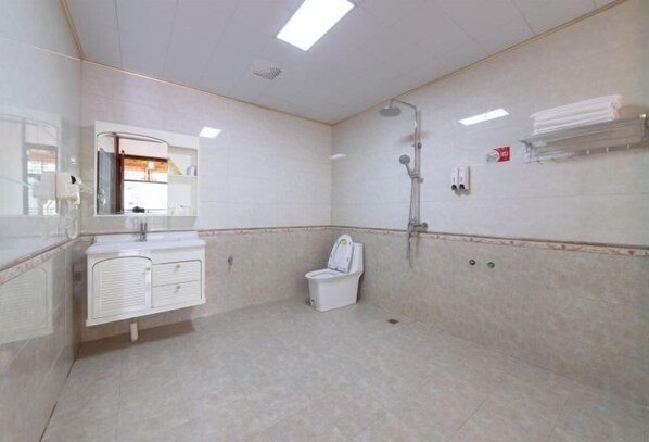A bathroom with a toilet, shower, and a mirror above the sink. - Longji Rice Terraces Heshe Homestay (Longsheng)