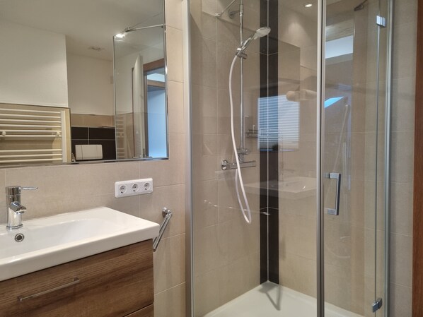 Shower, hair dryer, towels, soap