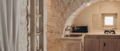 Fridge, stovetop, coffee/tea maker, cookware/dishes/utensils