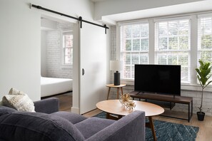 Signature Apartment, 1 Bedroom (Self Check-in with Virtual Front Desk) | Living area | 45-inch Smart TV with digital channels, TV, streaming services - Kasa Studio Revival Atlanta (Atlanta)